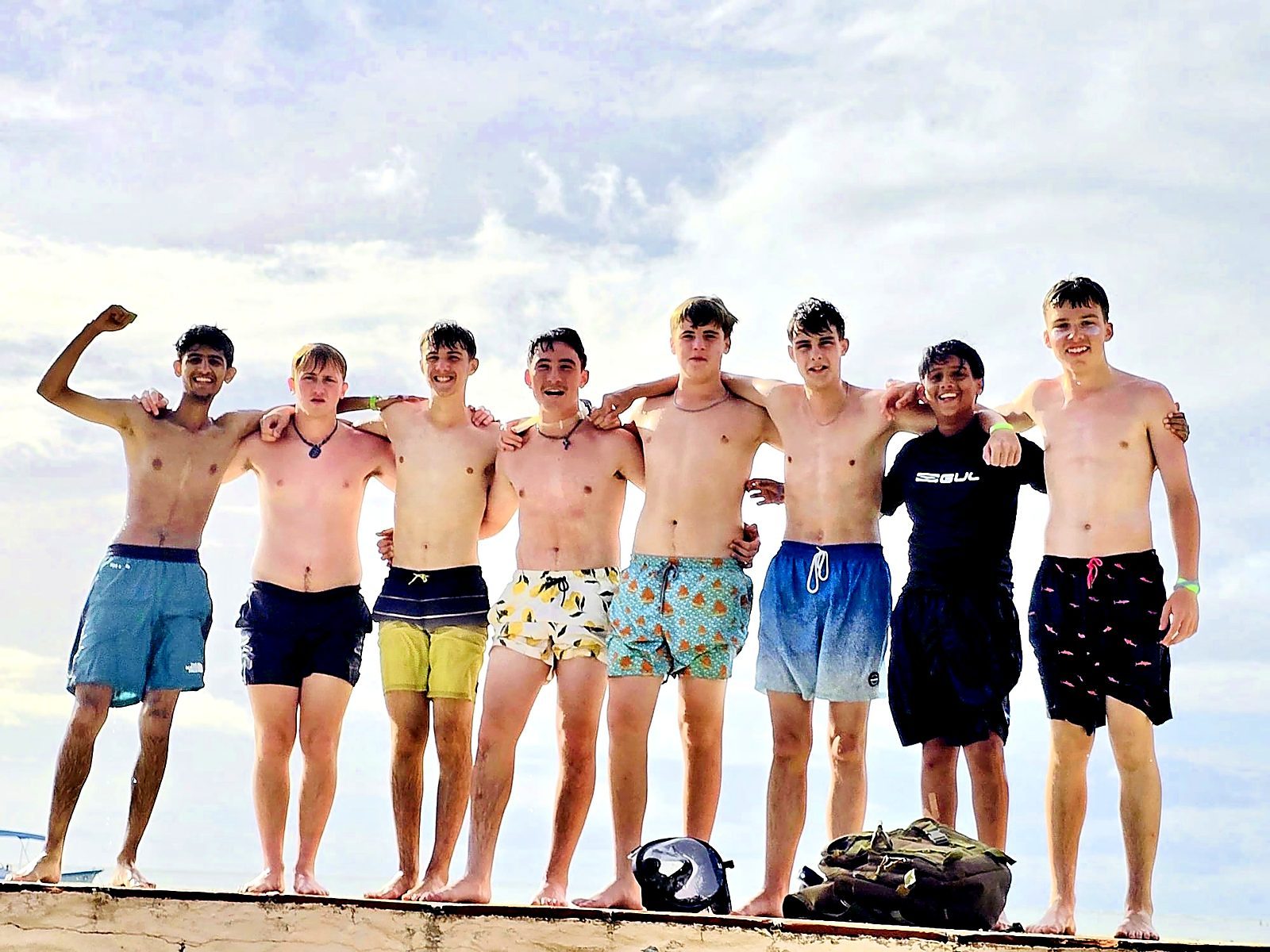 A squad lined up on the beach in Tobago