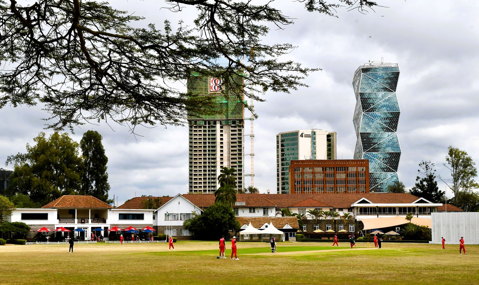 A match at Nairobi Club, with the clubhouse and city skyline behind
