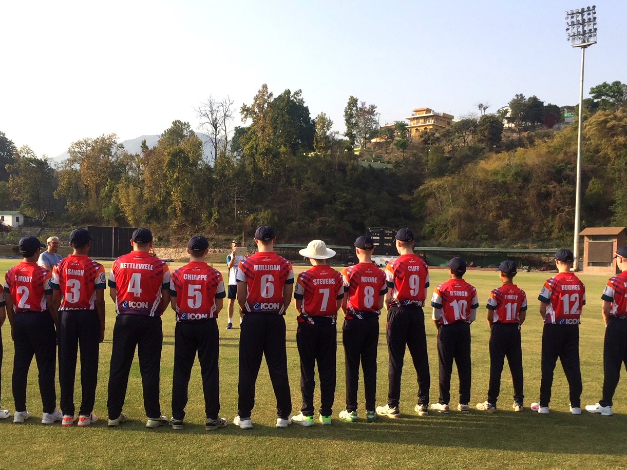 A touring squad lines up before a match